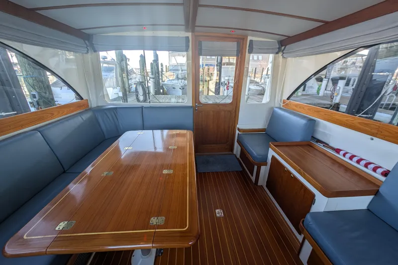 Slide: The Image of Interior of 1998 Little Harbor WhisperJet 55 yacht with elegant wood and blue seating. - 15
