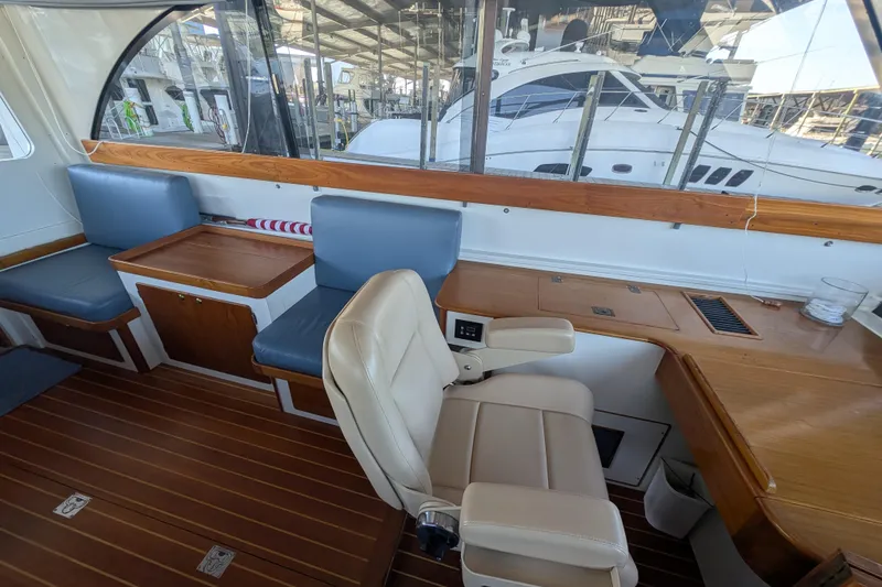 Slide: The Image of Interior helm of 1998 Little Harbor WhisperJet 55 with navigation equipment and wooden finish. - 16