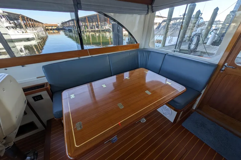 Slide: The Image of Interior of 1998 Little Harbor WhisperJet 55 yacht with elegant wood and blue seating. - 17
