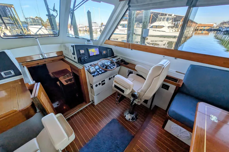 Slide: The Image of Interior of 1998 Little Harbor WhisperJet 55 yacht with helm and seating area. - 18