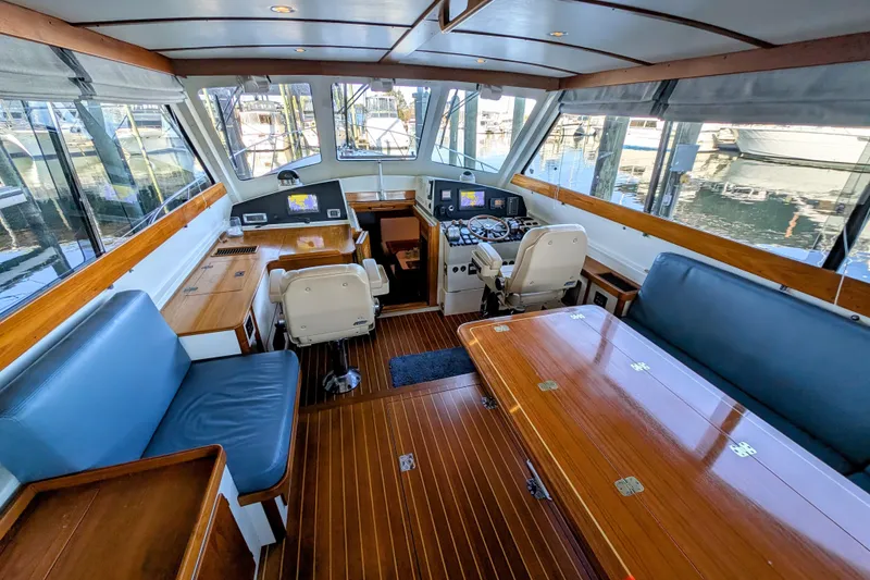 Slide: The Image of Interior of 1998 Little Harbor WhisperJet 55 yacht with wood accents and navigation equipment. - 19