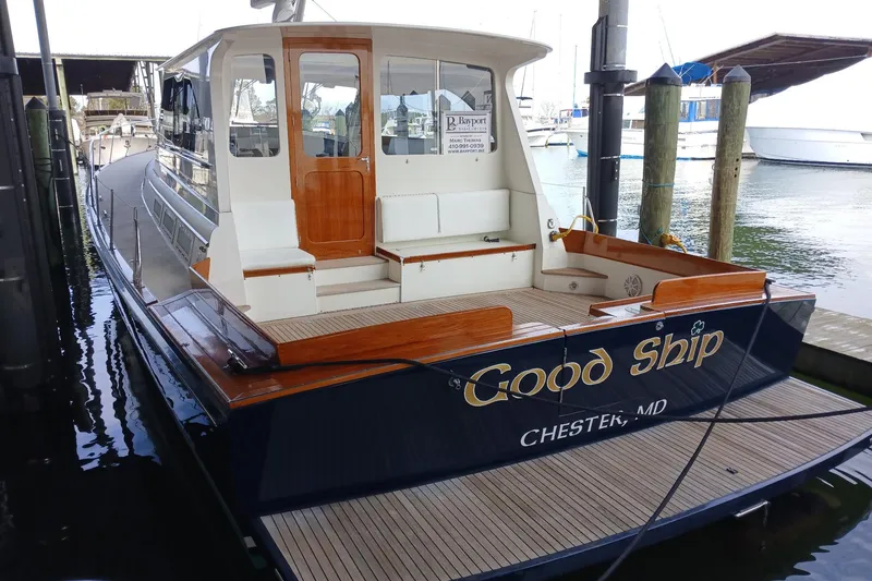 Slide: The Image of 1998 Little Harbor WhisperJet 55 docked, featuring elegant wooden accents and spacious deck. - 2