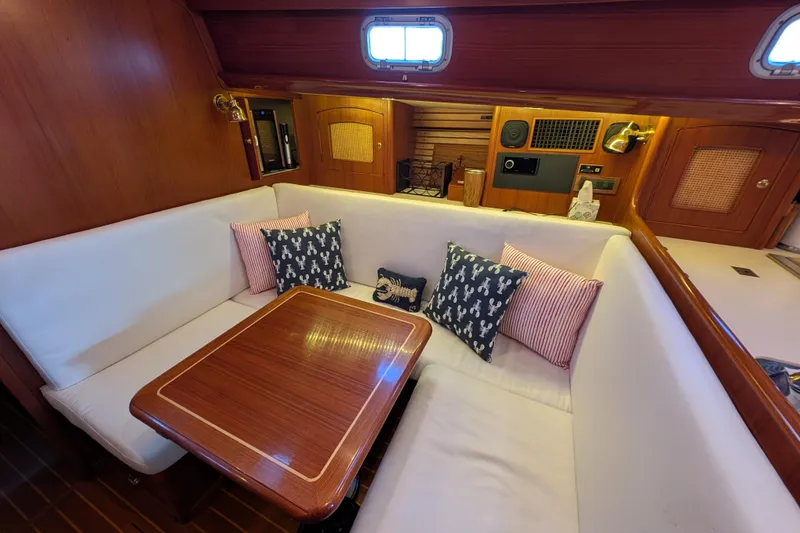 Slide: The Image of Cozy interior of 1998 Little Harbor WhisperJet 55 with elegant wood finish and plush seating. - 24
