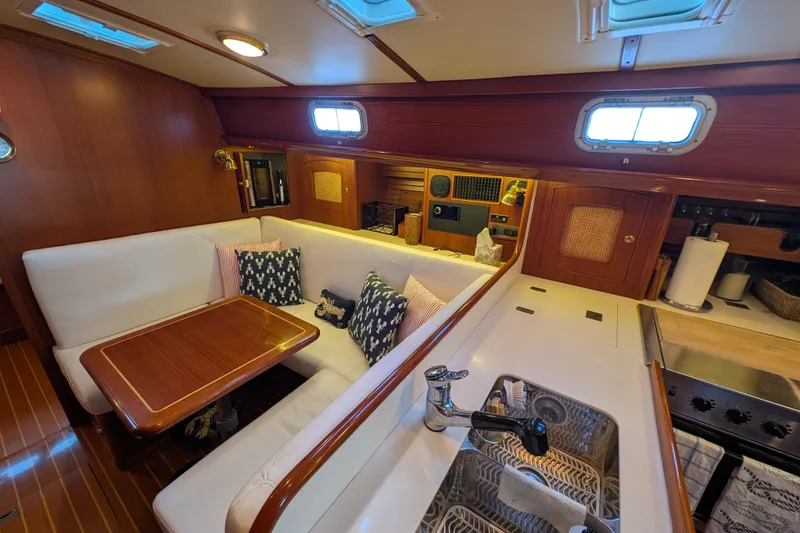Slide: The Image of Luxurious interior of 1998 Little Harbor WhisperJet 55 yacht with cozy seating and kitchen area. - 25