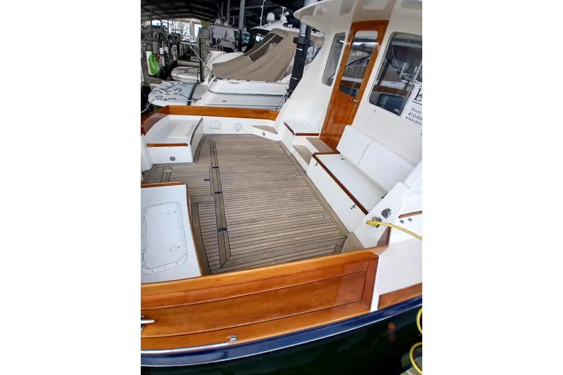 Slide: The Image of 1998 Little Harbor WhisperJet 55 yacht with spacious teak deck and elegant wood finishes. - 3