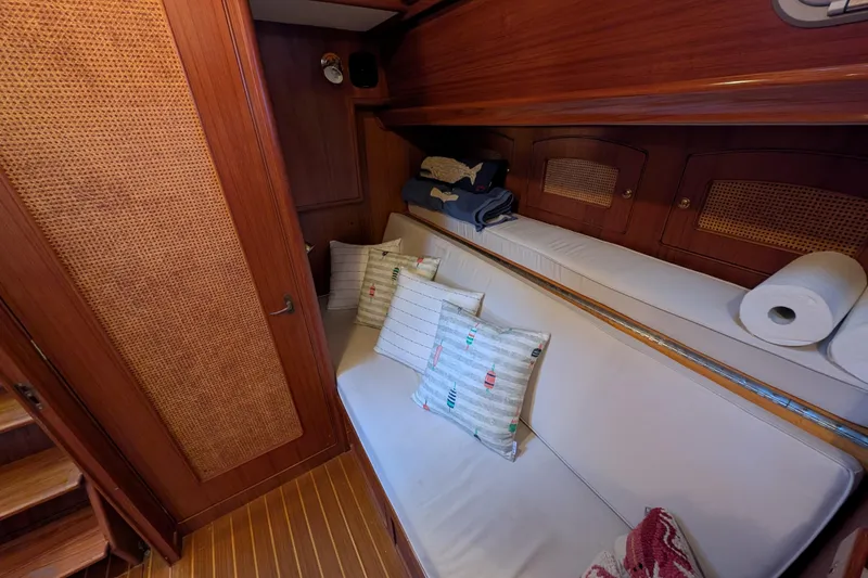 Slide: The Image of Interior of 1998 Little Harbor WhisperJet 55 yacht with cozy seating and wooden accents. - 32