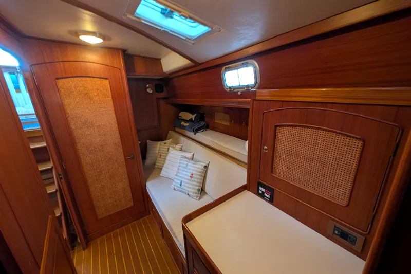 Slide: The Image of Cozy cabin interior of 1998 Little Harbor WhisperJet 55 yacht with wooden furnishings. - 34