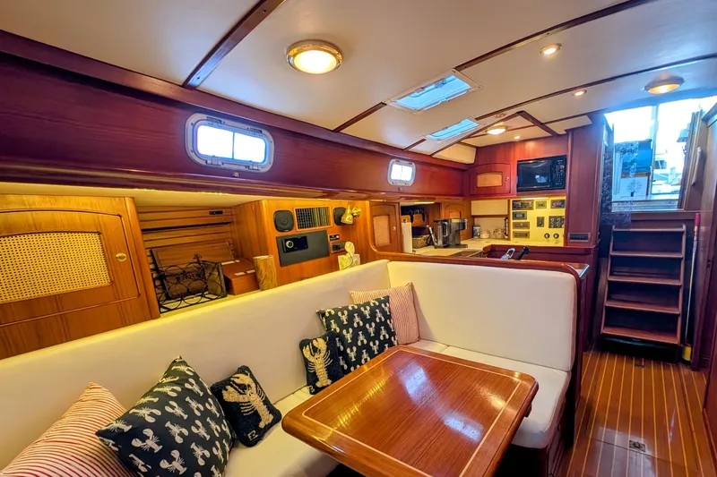Slide: The Image of Interior of 1998 Little Harbor WhisperJet 55 yacht with cozy seating and wooden finishes. - 38