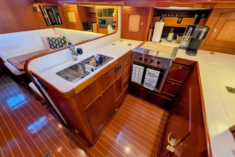 Slide: The Image of Luxurious 1998 Little Harbor WhisperJet 55 yacht interior with elegant wooden kitchen design. - 40