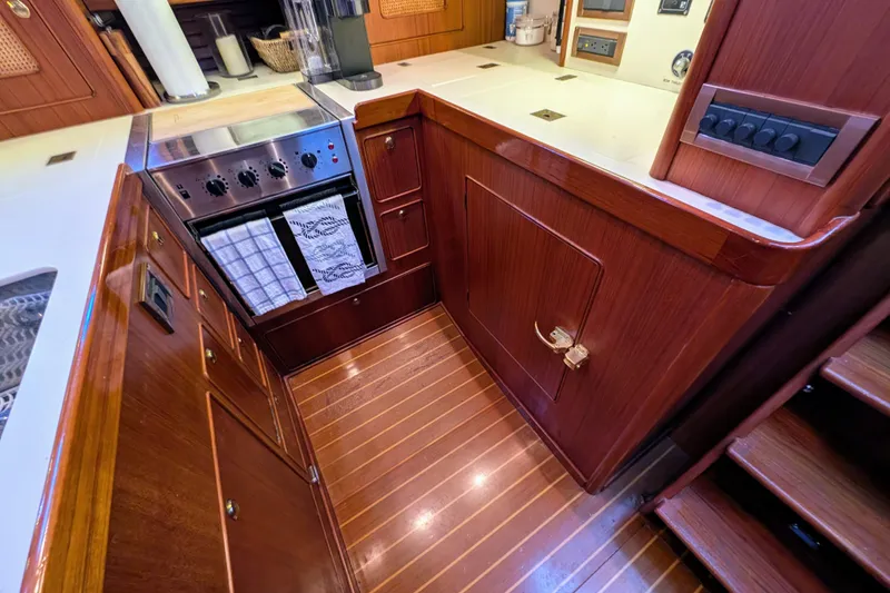Slide: The Image of Luxurious wooden galley interior of 1998 Little Harbor WhisperJet 55 yacht, featuring modern appliances. - 41