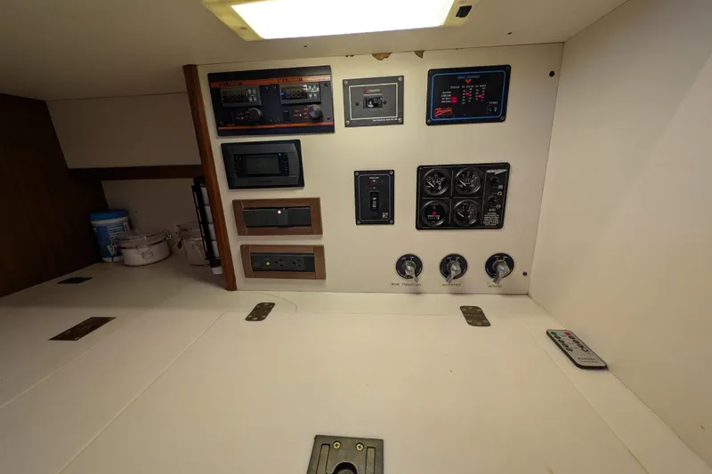 Slide: The Image of Control panel of a 1998 Little Harbor WhisperJet 55 yacht, featuring various switches and gauges. - 42