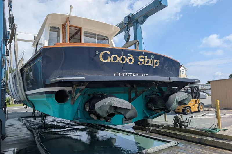Slide: The Image of 1998 Little Harbor WhisperJet 55 boat named "Good Ship" on a lift at a marina. - 45
