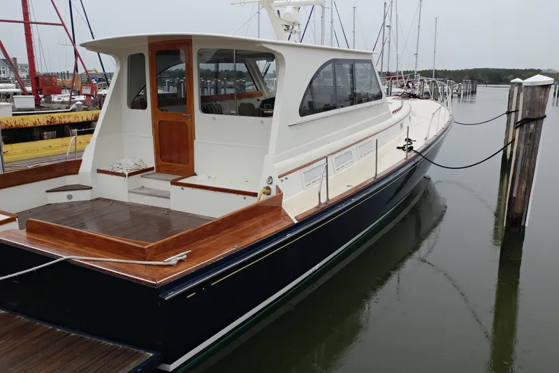 Slide: The Image of 1998 Little Harbor WhisperJet 55 yacht docked at marina, showcasing elegant design and craftsmanship. - 49