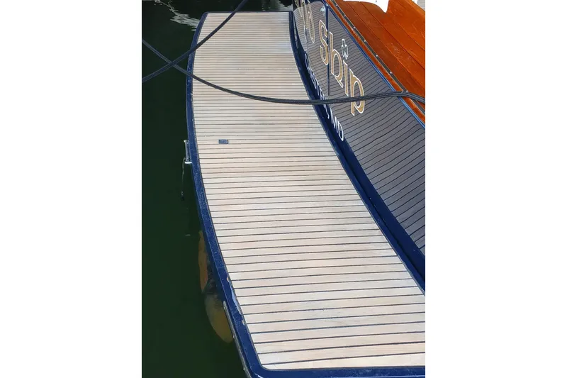 Slide: The Image of Teak deck of 1998 Little Harbor WhisperJet 55 yacht, featuring elegant wood finish. - 7