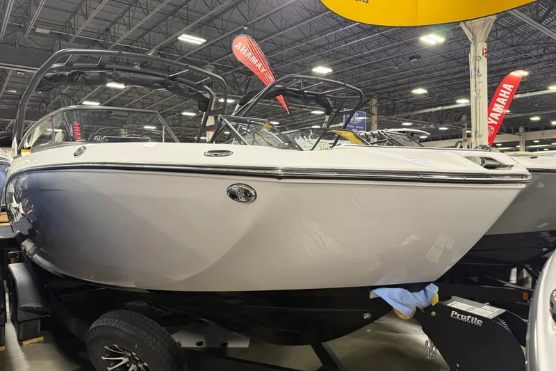 Slide: The Image of 2026 Yamaha Boats 252S displayed indoors at a boat show. - 1