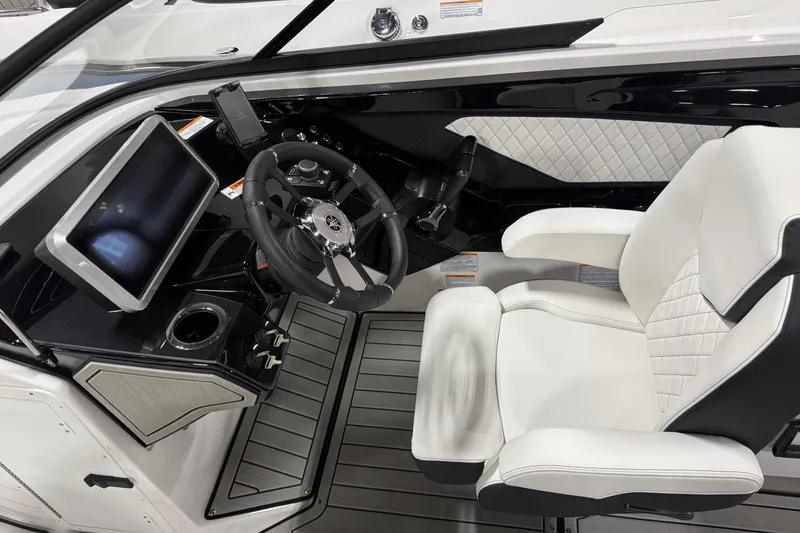 Slide: The Image of 2026 Yamaha Boats 252S cockpit with modern steering wheel and touchscreen display. - 4