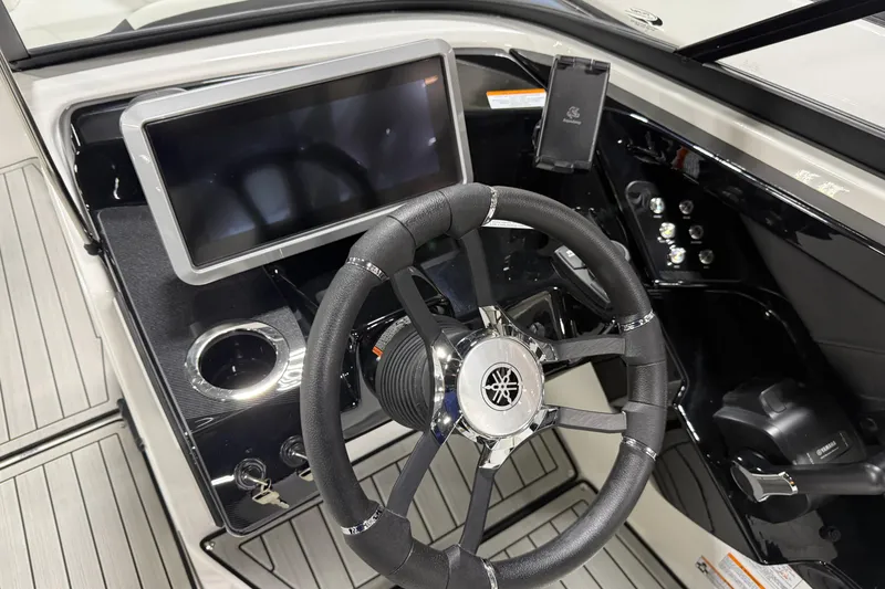 Slide: The Image of 2026 Yamaha Boats 252S dashboard with steering wheel and touchscreen display. - 5