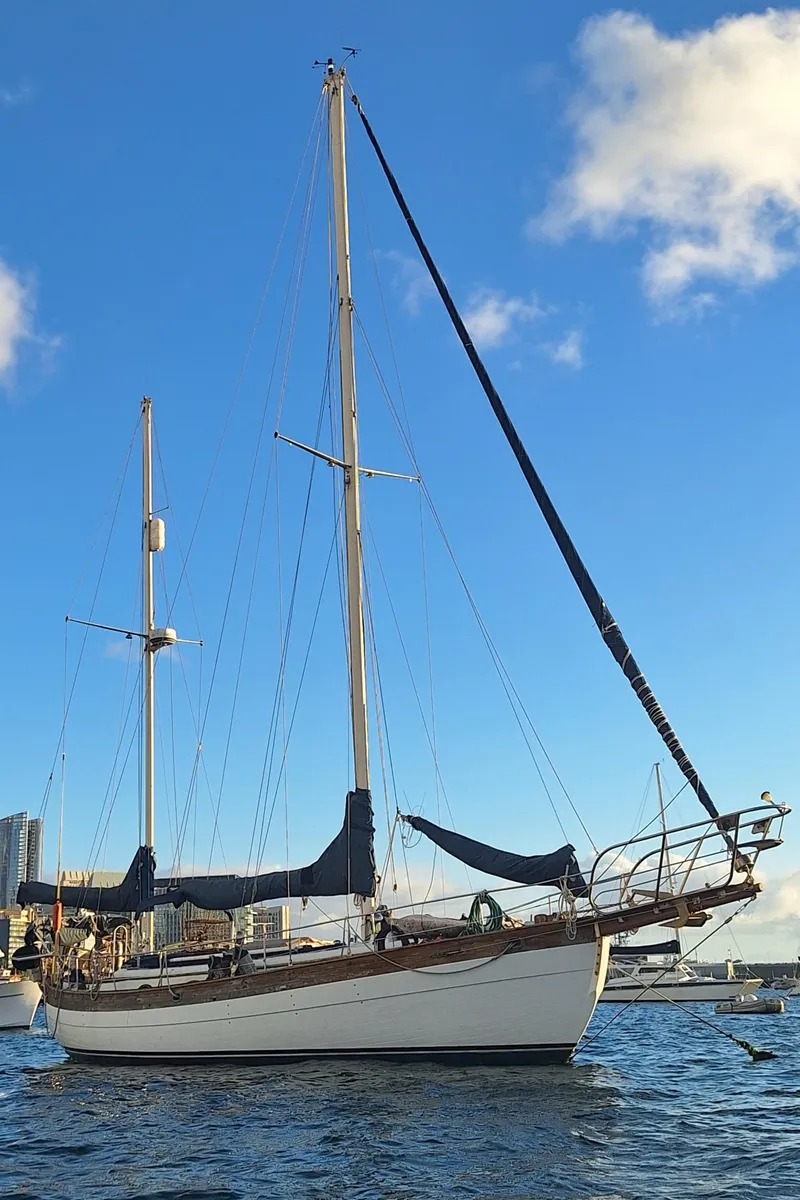 Slide: The Image of 1977 Hans Christian 38 sailboat on water under clear blue sky. - 5