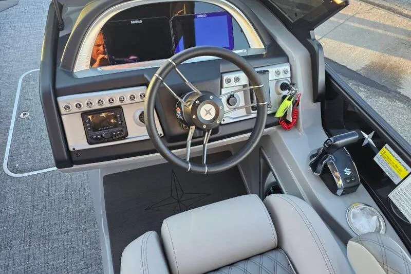 Slide: The Image of Cockpit of 2026 Berkshire 25RFX DC STS SPORT ARCH with modern steering and controls. - 23