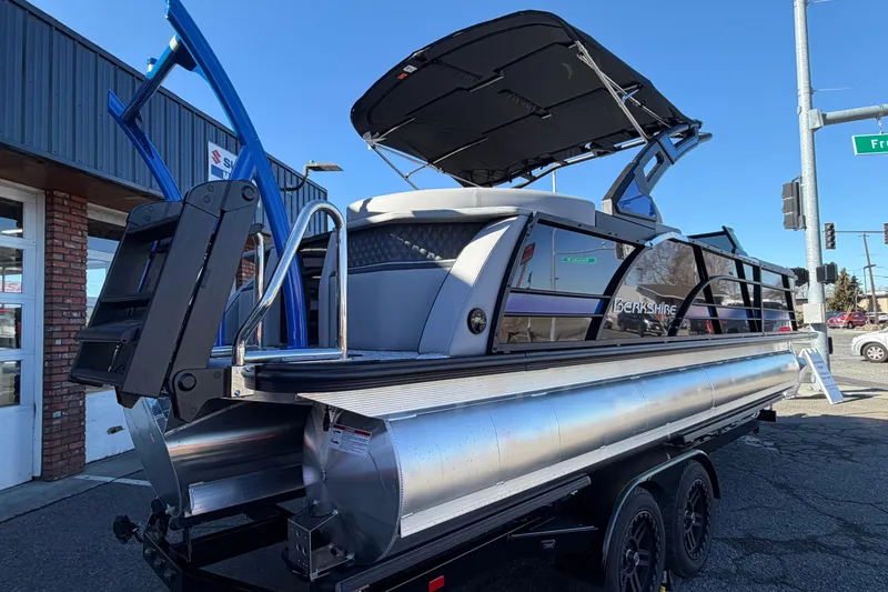 Slide: The Image of 2026 Berkshire 25RFX DC STS SPORT ARCH pontoon boat on trailer, outdoor display. - 9