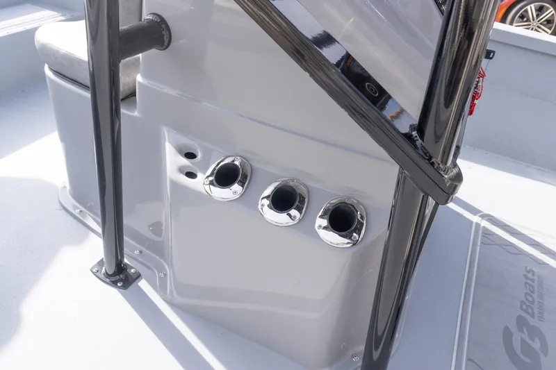 Slide: The Image of 2026 G3 Bay 21 GX boat console with chrome rod holders and sleek design. - 10
