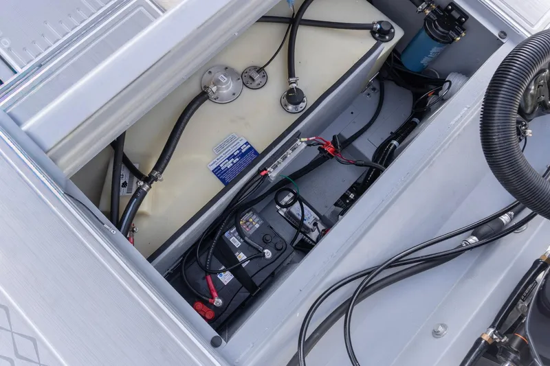 Slide: The Image of 2026 G3 Bay 21 GX boat interior showing fuel tank and wiring components. - 21