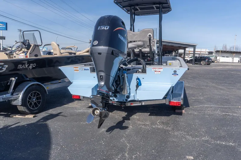 Slide: The Image of 2026 G3 Bay 21 GX boat with Yamaha 150 engine in a parking lot. - 3