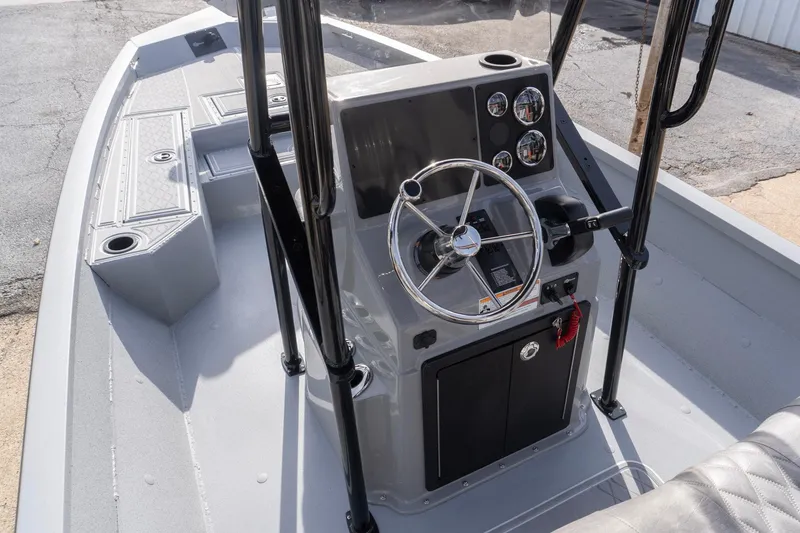 Slide: The Image of 2026 G3 Bay 21 GX boat console with steering wheel and gauges. - 7