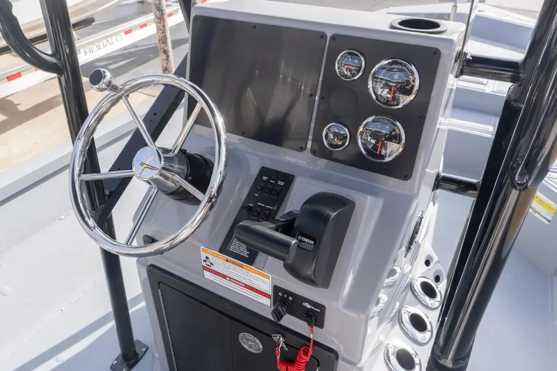 Slide: The Image of 2026 G3 Bay 21 GX boat console with steering wheel and gauges. - 8