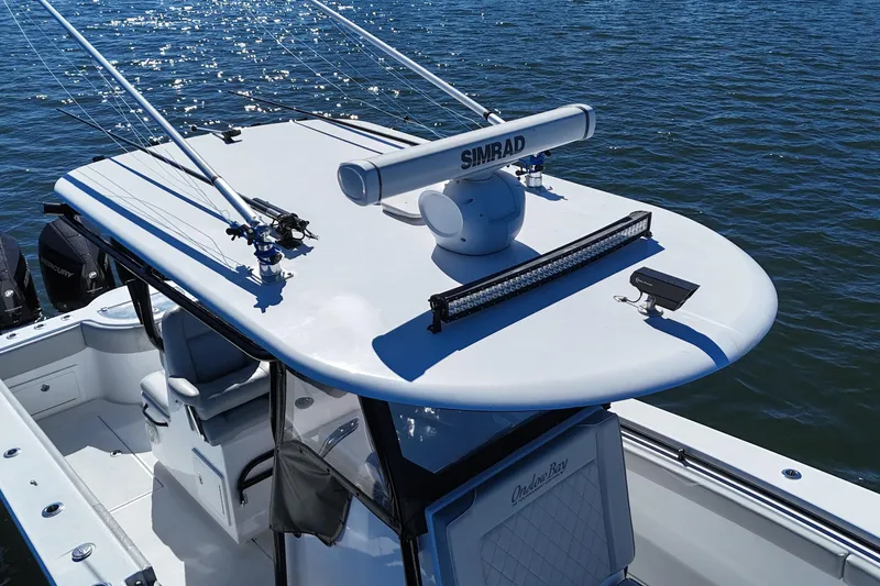 Slide: The Image of 2021 Onslow Bay 33 Tournament boat with Simrad radar on calm water. - 10