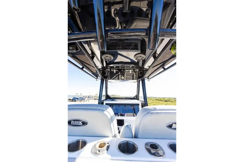 Slide: The Image of 2021 Onslow Bay 33 Tournament boat interior with seating and overhead speakers. - 15