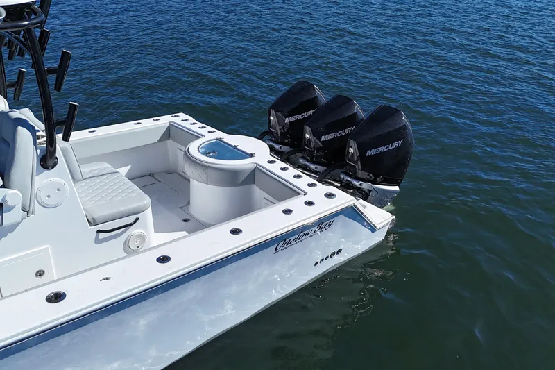 Slide: The Image of 2021 Onslow Bay 33 Tournament boat with triple Mercury engines on water. - 8