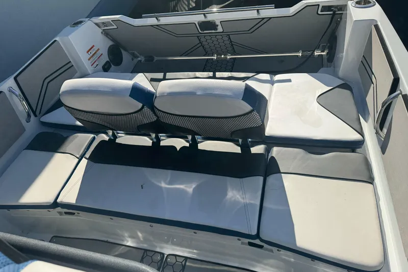 Slide: The Image of 2020 Scarab 255 Open ID boat interior with cushioned seating and modern design. - 11