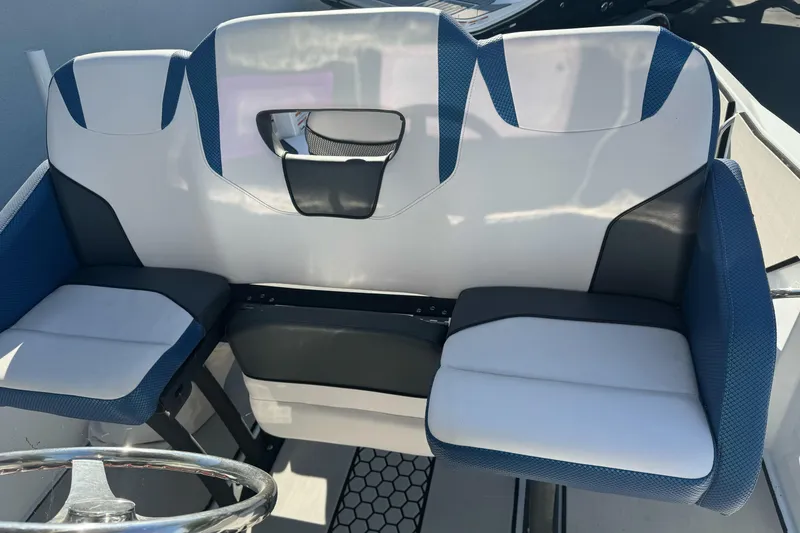 Slide: The Image of 2020 Scarab 255 Open ID boat seating with blue and white upholstery. - 15