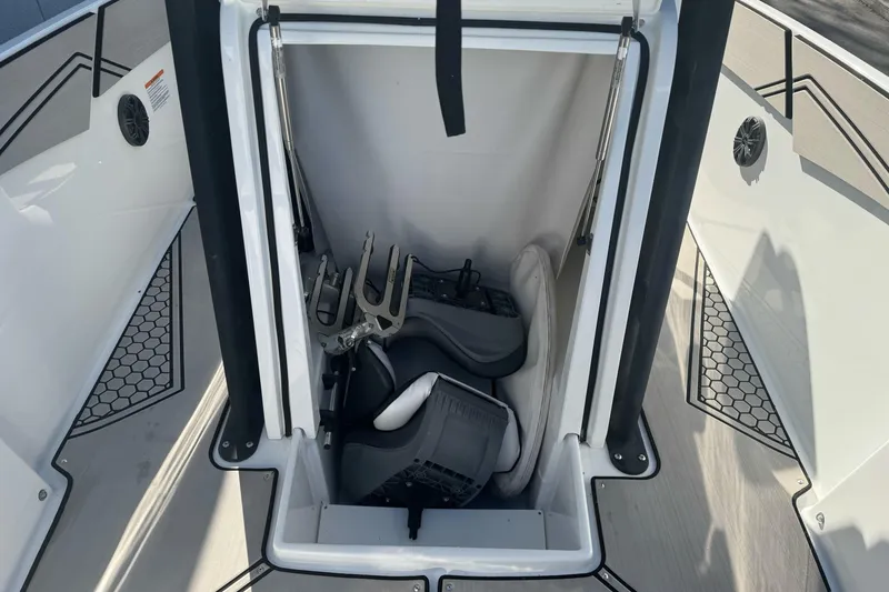Slide: The Image of 2020 Scarab 255 Open ID boat storage compartment with equipment and accessories. - 21