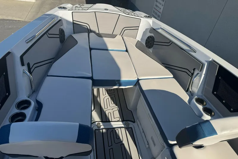 Slide: The Image of 2020 Scarab 255 Open ID boat interior with cushioned seating and cup holders. - 23