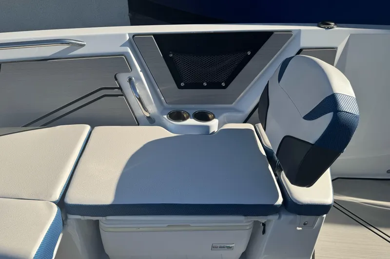 Slide: The Image of 2020 Scarab 255 Open ID boat interior with cushioned seating and cup holders. - 25