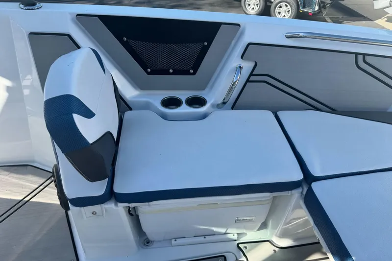 Slide: The Image of 2020 Scarab 255 Open ID boat interior seating with cup holders and storage. - 26