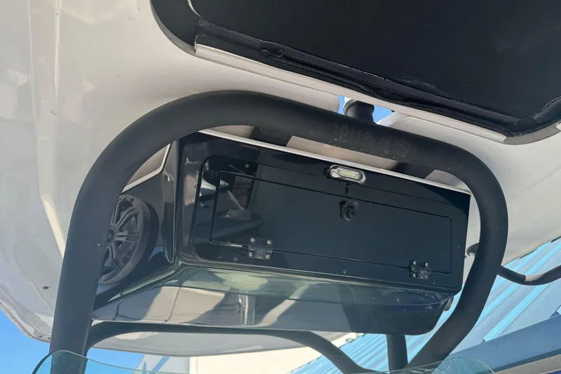 Slide: The Image of 2020 Scarab 255 Open ID boat with black storage compartment and speaker system. - 30