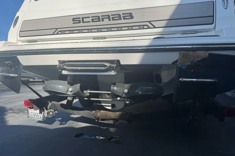 Slide: The Image of Rear view of a 2020 Scarab 255 Open ID boat on a trailer. - 7