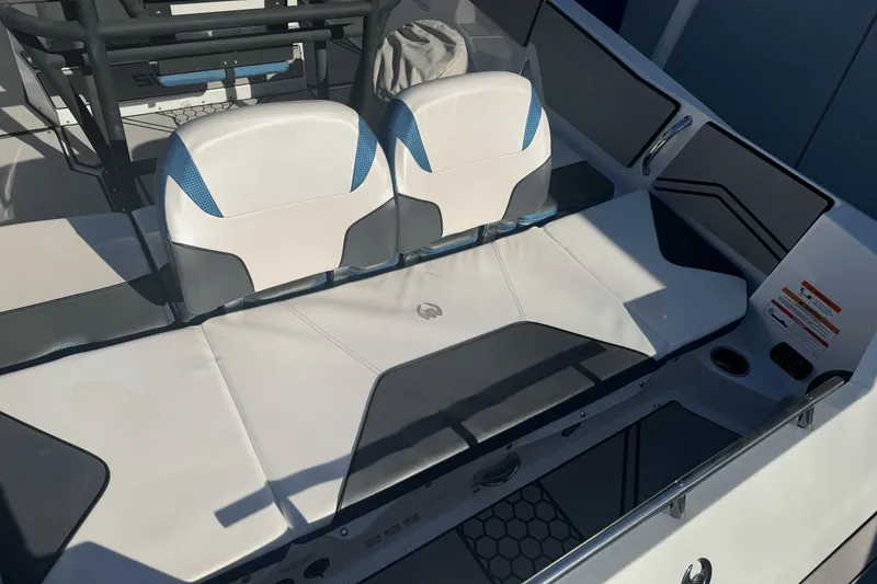 Slide: The Image of 2020 Scarab 255 Open ID boat interior with white and blue seating. - 8