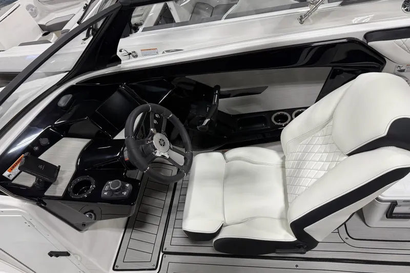 Slide: The Image of Interior of 2026 Yamaha Boats 222S, featuring sleek steering and luxurious seating. - 3