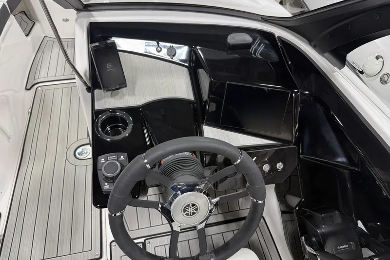 Slide: The Image of Interior view of 2026 Yamaha Boats 222S cockpit with steering wheel and control panel. - 4