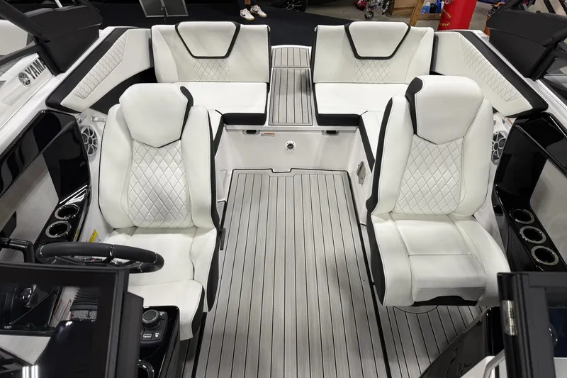 Slide: The Image of Interior of 2026 Yamaha Boats 222S, featuring luxurious white seating and sleek design. - 7