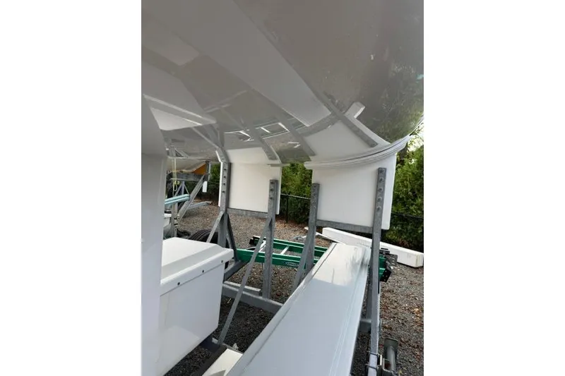 Slide: The Image of 2013 J Boats J/70 sailboat hull on a trailer, viewed from below. - 4