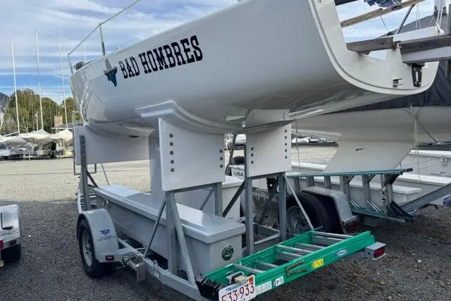 Slide: The Image of 2013 J Boats J/70 sailboat named "Bad Hombres" on a trailer in a boatyard. - 6