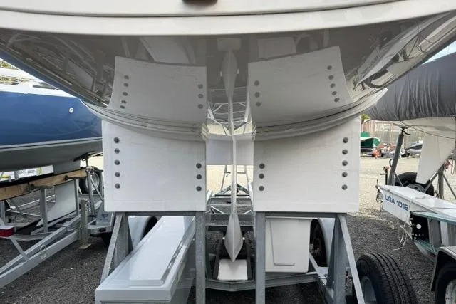 Slide: The Image of 2013 J Boats J/70 sailboat hull on trailer, showcasing underside and keel. - 8