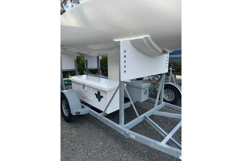 Slide: The Image of 2013 J Boats J/70 sailboat on trailer, parked outdoors. - 9