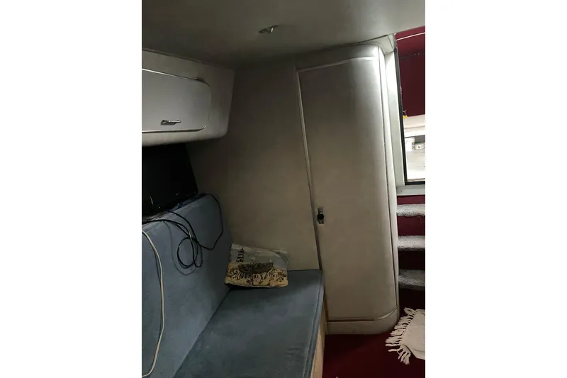 Slide: The Image of Interior cabin of 1987 Chris-Craft 332 Amerosport with seating and storage. - 12