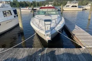 Slide: The Image of 1987 Chris-Craft 332 Amerosport docked at a marina, surrounded by other boats. - 2